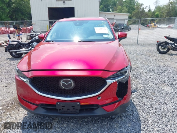 2021 Mazda CX-5 Grand Touring with VIN JM3KFBDM3M0434569, listed as a IAAI auction lot 42422349 with 25,924 mi miles and . Bid and sale history available at DreamBid. Image 6.