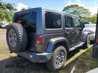 2014 Jeep Wrangler Unlimited Rubicon with VIN 1C4HJWFG7EL302897, listed as a Copart auction lot 48969425 with 57,976 mi miles and Salvage title. Bid and sale history available at DreamBid. Image 3.