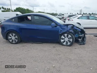 2022 Tesla Model Y Long Range z VIN 7SAYGDEE9NA002493, wystawiony jako IAAI lot #41756460 z przebiegiem 68 315 mil mil oraz . Historia ofert i sprzedaży dostępna na DreamBid. Obrazek 12.