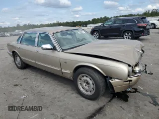 1999 Jaguar XJ z VIN SAJKX6048XC849376, wystawiony jako Copart lot #70538064 z przebiegiem 122 891 mil mil oraz Szkoda całkowita • Salvage title. Historia ofert i sprzedaży dostępna na DreamBid. Obrazek 4.
