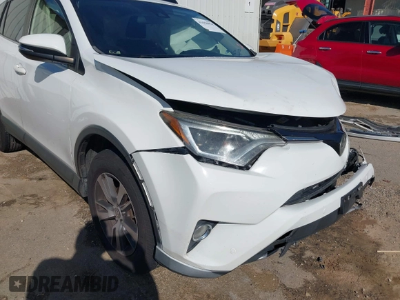 2017 Toyota RAV4 XLE with VIN JTMWFREV9HJ128521, listed as a IAAI auction lot 41658054 with 106,788 mi miles and . Bid and sale history available at DreamBid. Image 17.