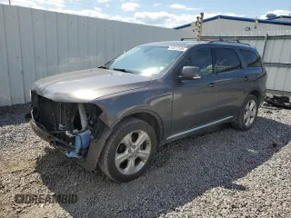 2014 Dodge Durango Limited z VIN 1C4RDJDG1EC973550, wystawiony jako Copart lot #65877585 z przebiegiem 168 971 mil mil oraz Szkoda całkowita • Salvage title. Historia ofert i sprzedaży dostępna na DreamBid. Obrazek 1.
