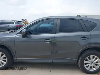 2016 Mazda CX-5 Sport with VIN JM3KE4BY8G0921243, listed as a IAAI auction lot 42102663 with 111,960 mi miles and . Bid and sale history available at DreamBid. Image 14.
