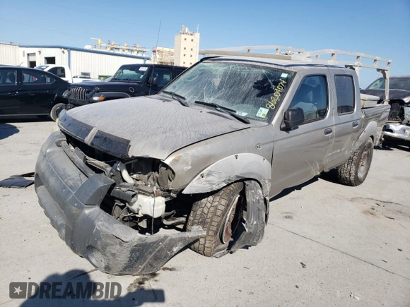 2002 Nissan Frontier SE with VIN 1N6ED27T52C383700, listed as a Copart auction lot 86204074 with 216,908 mi miles and Salvage title. Bid and sale history available at DreamBid. Image 1.