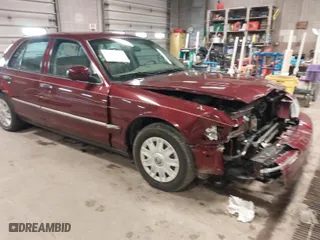 2004 Mercury Grand Marquis GS with VIN 2MEFM74W44X660876, listed as a IAAI auction lot 41915559 with 138,546 mi miles. Bid and sale history available at carsss.com. Image 1.