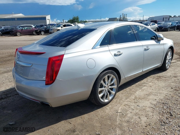 2015 Cadillac XTS Luxury with VIN 2G61N5S36F9251701, listed as a IAAI auction lot 40315224 with 99,918 mi miles. Bid and sale history available at carsss.com. Image 4.