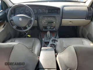 2000 Cadillac Catera z VIN W06VR54R1YR003905, wystawiony jako Copart lot #76417144 z przebiegiem 80 894 mil mil oraz Tytuł czysty. Historia ofert i sprzedaży dostępna na DreamBid. Obrazek 8.