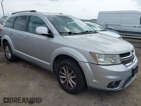 2013 Dodge Journey SXT with VIN 3C4PDDBG4DT571469, listed as a IAAI auction lot 42104433 with 166,068 mi miles and . Bid and sale history available at DreamBid. Image 1.