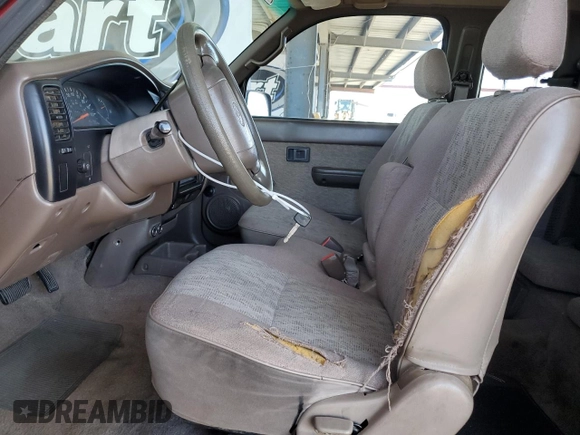 1999 Toyota Tacoma с VIN 4TAVL52N5XZ564845, выставлен на аукционе Copart как лот 57623895 с пробегом 303 101 миль миль и Списание • Salvage title. История ставок и продаж доступна на DreamBid. Изображение 7.