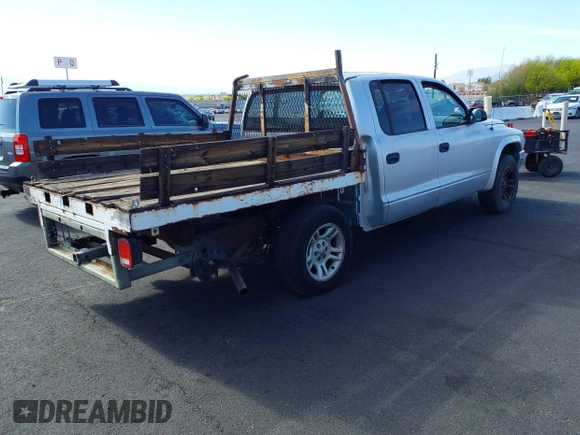 2003 Dodge Dakota SLT with VIN 1D7HL48N33S295059, listed as a IAAI auction lot 42085612 with 176,934 mi miles. Bid and sale history available at carsss.com. Image 4.