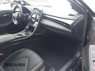 2021 Toyota Avalon Hybrid XSE z VIN 4T1EA1AB2MU002741, wystawiony jako IAAI lot #41865444 z przebiegiem 141 196 mil mil oraz . Historia ofert i sprzedaży dostępna na DreamBid. Obrazek 5.
