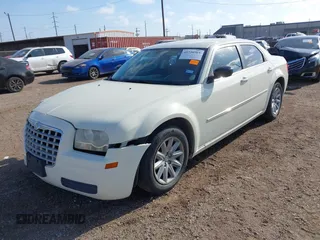 2008 Chrysler 300 LX with VIN 2C3KA43R18H258997, listed as a IAAI auction lot 41730765 with 135,905 mi miles. Bid and sale history available at carsss.com. Image 2.
