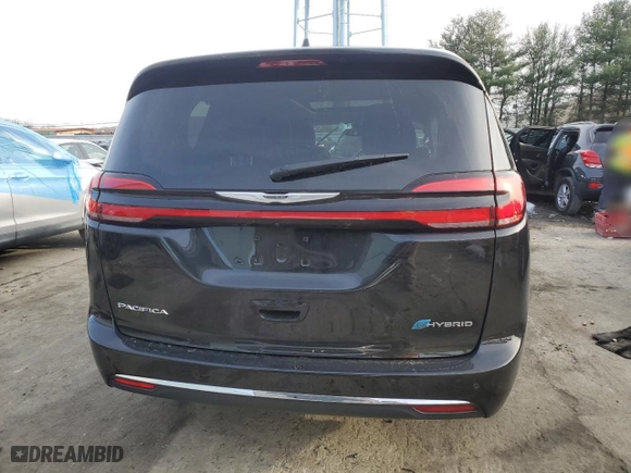 2023 Chrysler Pacifica Hybrid Limited with VIN 2C4RC1S77PR599221, listed as a Copart auction lot 82690554 with 12,013 mi miles and Salvage Title. Bid and sale history available at carsss.com. Image 6.