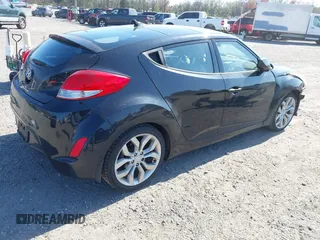 2013 Hyundai Veloster w/Gray Int with VIN KMHTC6AD4DU131242, listed as a IAAI auction lot 42074517 with 76,713 mi miles and . Bid and sale history available at DreamBid. Image 4.