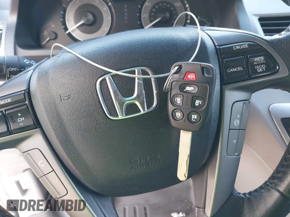 2011 Honda Odyssey Touring with VIN 5FNRL5H9XBB085626, listed as a IAAI auction lot 41890577 with 178,317 mi miles and . Bid and sale history available at DreamBid. Image 11.