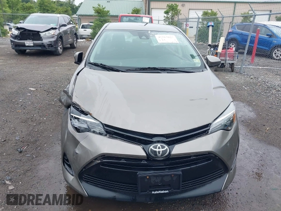 2018 Toyota Corolla L with VIN 2T1BURHE9JC990834, listed as a IAAI auction lot 42583027 with 217,143 mi miles and . Bid and sale history available at DreamBid. Image 12.