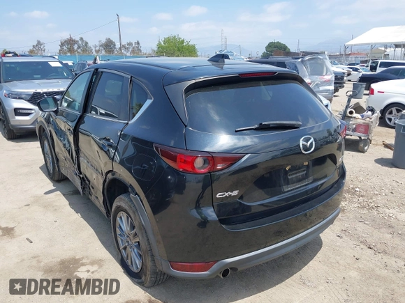 2017 Mazda CX-5 Touring with VIN JM3KFACL0H0124632, listed as a IAAI auction lot 42134971 with 107,029 mi miles and . Bid and sale history available at carsss.com. Image 3.