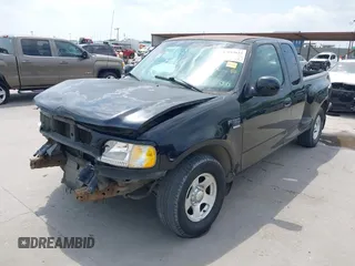 2002 Ford F-150 XL z VIN 1FTRX07W12KD47521, wystawiony jako IAAI lot #42044623 z przebiegiem 334 930 mil mil oraz . Historia ofert i sprzedaży dostępna na DreamBid. Obrazek 20.