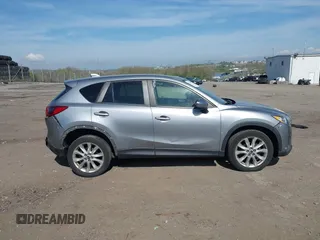 2014 Mazda CX-5 Grand Touring with VIN JM3KE4DY7E0311893, listed as a IAAI auction lot 42090872 with 102,154 mi miles and . Bid and sale history available at DreamBid. Image 13.