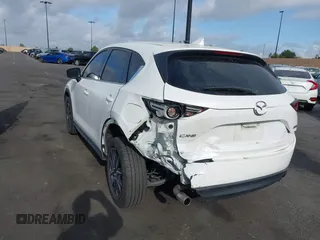 2018 Mazda CX-5 Grand Touring with VIN JM3KFADMXJ0470846, listed as a IAAI auction lot 41913533 with 54,700 mi miles and . Bid and sale history available at DreamBid. Image 3.