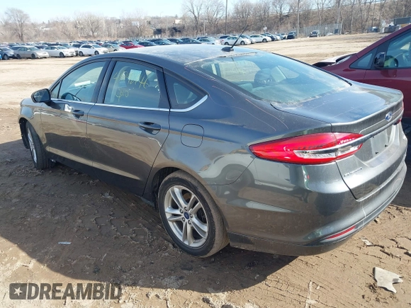 2018 Ford Fusion SE z VIN 3FA6P0HD7JR211569, wystawiony jako IAAI lot #41792146 z przebiegiem 187 505 mil mil oraz . Historia ofert i sprzedaży dostępna na DreamBid. Obrazek 3.