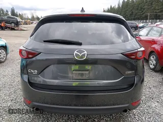 2021 Mazda CX-5 Touring with VIN JM3KFBCM2M0484011, listed as a IAAI auction lot 41825954 with 48,958 mi miles. Bid and sale history available at carsss.com. Image 16.