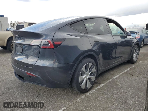 2024 Tesla Model Y with VIN 7SAYGDED1RF052031, listed as a Copart auction lot 48507865 with 5,365 mi miles and Salvage title. Bid and sale history available at DreamBid. Image 3.