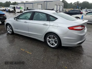 2016 Ford Fusion SE Hybrid z VIN 3FA6P0LUXGR350997, wystawiony jako Copart lot #62301825 z przebiegiem 267 537 mil mil oraz Szkoda całkowita • Salvage title. Historia ofert i sprzedaży dostępna na DreamBid. Obrazek 2.