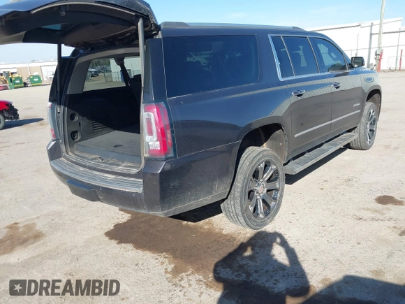 2015 GMC Yukon XL Denali with VIN 1GKS2JKJ9FR634771, listed as a IAAI auction lot 41676218 with 73,271 mi miles. Bid and sale history available at carsss.com. Image 4.