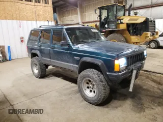 1996 Jeep Cherokee Sport with VIN 1J4FJ68S1TL226495, listed as a Copart auction lot 58587685 with 205,397 mi miles and Salvage title. Bid and sale history available at DreamBid. Image 4.