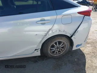 2021 Toyota Prius LE with VIN JTDKAMFP2M3177459, listed as a IAAI auction lot 42093828 with 65,501 mi miles and . Bid and sale history available at DreamBid. Image 6.
