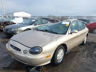 1999 Ford Taurus SE with VIN 1FAFP53U3XA131984, listed as a IAAI auction lot 41638566 with 84,836 mi miles. Bid and sale history available at carsss.com. Image 2.