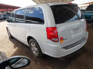 2012 Dodge Grand Caravan SE with VIN 2C4RDGBGXCR407641, listed as a IAAI auction lot 41950812 with 151,331 mi miles and . Bid and sale history available at DreamBid. Image 3.
