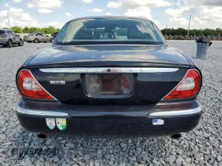 2004 Jaguar XJ with VIN SAJEA71C14SG10928, listed as a Copart auction lot 51202785 with 164,300 mi miles and Salvage Title. Bid and sale history available at carsss.com. Image 6.