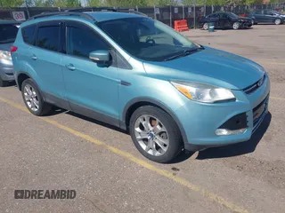 2013 Ford Escape SEL with VIN 1FMCU9HX4DUB95893, listed as a IAAI auction lot 42167435 with 142,016 mi miles. Bid and sale history available at carsss.com. Image 1.