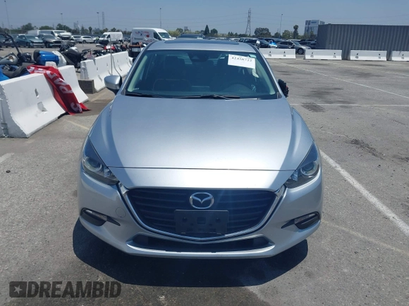 2018 Mazda 3 Touring z VIN 3MZBN1V35JM272638, wystawiony jako IAAI lot #42458722 z przebiegiem 98 393 mil mil oraz . Historia ofert i sprzedaży dostępna na DreamBid. Obrazek 12.