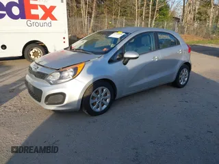 2013 Kia Rio LX with VIN KNADM5A32D6168492, listed as a IAAI auction lot 42144898 with 127,228 mi miles. Bid and sale history available at carsss.com. Image 2.