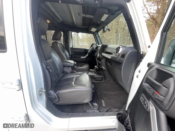 2016 Jeep Wrangler Unlimited 75th Anniversary with VIN 1C4BJWEG5GL215915, listed as a Copart auction lot 52680895 with 143,836 mi miles and Clean Title. Bid and sale history available at carsss.com. Image 5.