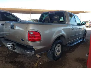 2003 Ford F-150 XLT with VIN 1FTRW07693KA29179, listed as a IAAI auction lot 41726462 with 191,365 mi miles. Bid and sale history available at carsss.com. Image 4.