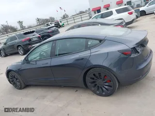 2022 Tesla Model 3 Performance with VIN 5YJ3E1EC9NF130410, listed as a IAAI auction lot 41711708 with 26,937 mi miles. Bid and sale history available at carsss.com. Image 15.