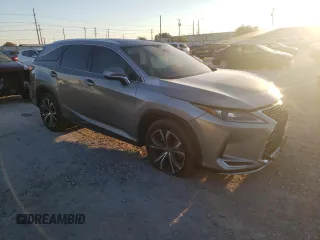 2021 Lexus RX 350L z VIN JTJHZKEA0M2019757, wystawiony jako Copart lot #71006144 z przebiegiem Nie podano mil oraz Szkoda całkowita • Salvage title. Historia ofert i sprzedaży dostępna na DreamBid. Obrazek 4.