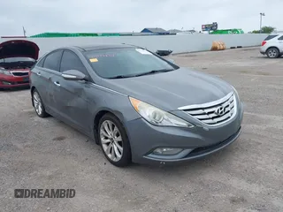 2013 Kia Optima EX z VIN 5XXGN4A75DG148460, wystawiony jako IAAI lot #42414837 z przebiegiem 163 999 mil mil oraz . Historia ofert i sprzedaży dostępna na DreamBid. Obrazek 1.