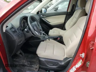2014 Mazda CX-5 Touring with VIN JM3KE2CY6E0316041, listed as a Copart auction lot 52227835 with 69,921 mi miles and Salvage Title. Bid and sale history available at DreamBid. Image 7.