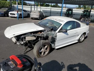 1995 Ford Mustang with VIN 1FALP4040SF194814, listed as a Copart auction lot 63484335 with 142,935 mi miles and Salvage title. Bid and sale history available at DreamBid. Image 1.