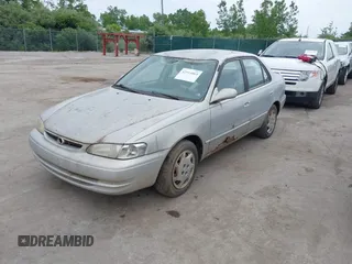 1999 Toyota Corolla VE z VIN 2T1BR12E7XC154444, wystawiony jako IAAI lot #42514069 z przebiegiem 209 377 mil mil oraz . Historia ofert i sprzedaży dostępna na DreamBid. Obrazek 2.