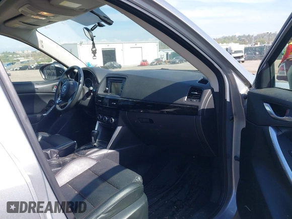 2014 Mazda CX-5 Grand Touring with VIN JM3KE4DY7E0311893, listed as a IAAI auction lot 42090872 with 102,154 mi miles and . Bid and sale history available at DreamBid. Image 5.