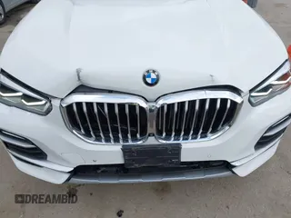 2021 BMW X5 xDrive40i with VIN 5UXCR6C03M9G36156, listed as a IAAI auction lot 42125009 with 30,877 mi miles. Bid and sale history available at carsss.com. Image 6.