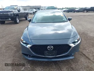 2022 Mazda 3 Carbon Edition z VIN 3MZBPACL7NM313242, wystawiony jako IAAI lot #42095279 z przebiegiem 30 787 mil mil oraz . Historia ofert i sprzedaży dostępna na DreamBid. Obrazek 12.