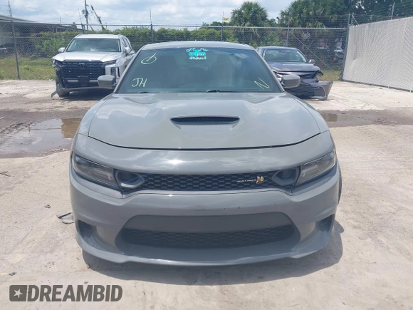 2019 Dodge Charger Scat Pack with VIN 2C3CDXGJ2KH633854, listed as a IAAI auction lot 42212517 with 74,285 mi miles and . Bid and sale history available at DreamBid. Image 12.