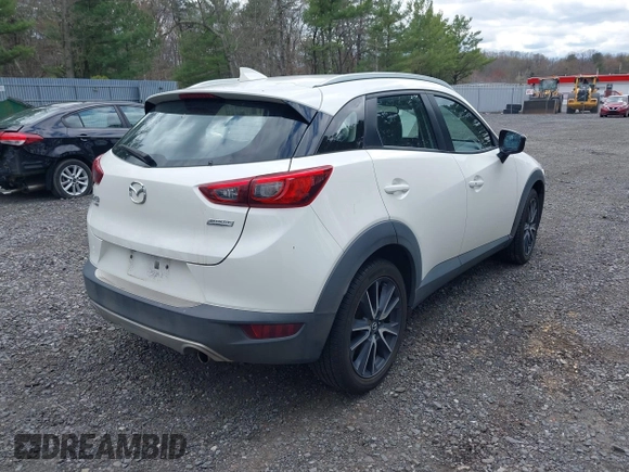 2018 Mazda CX-3 Touring with VIN JM1DKFC71J0315074, listed as a IAAI auction lot 42029790 with 100,268 mi miles. Bid and sale history available at carsss.com. Image 4.